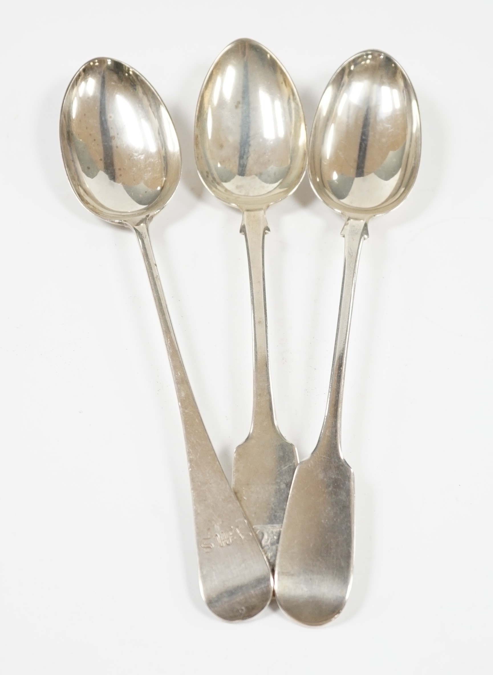 Three assorted 19th century silver basting spoons, including two fiddle pattern, earliest London, 1832, 31cm et infra, 13.8oz. Condition - fair